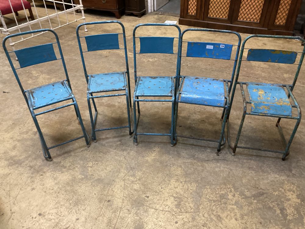 Four painted metal stacking chairs